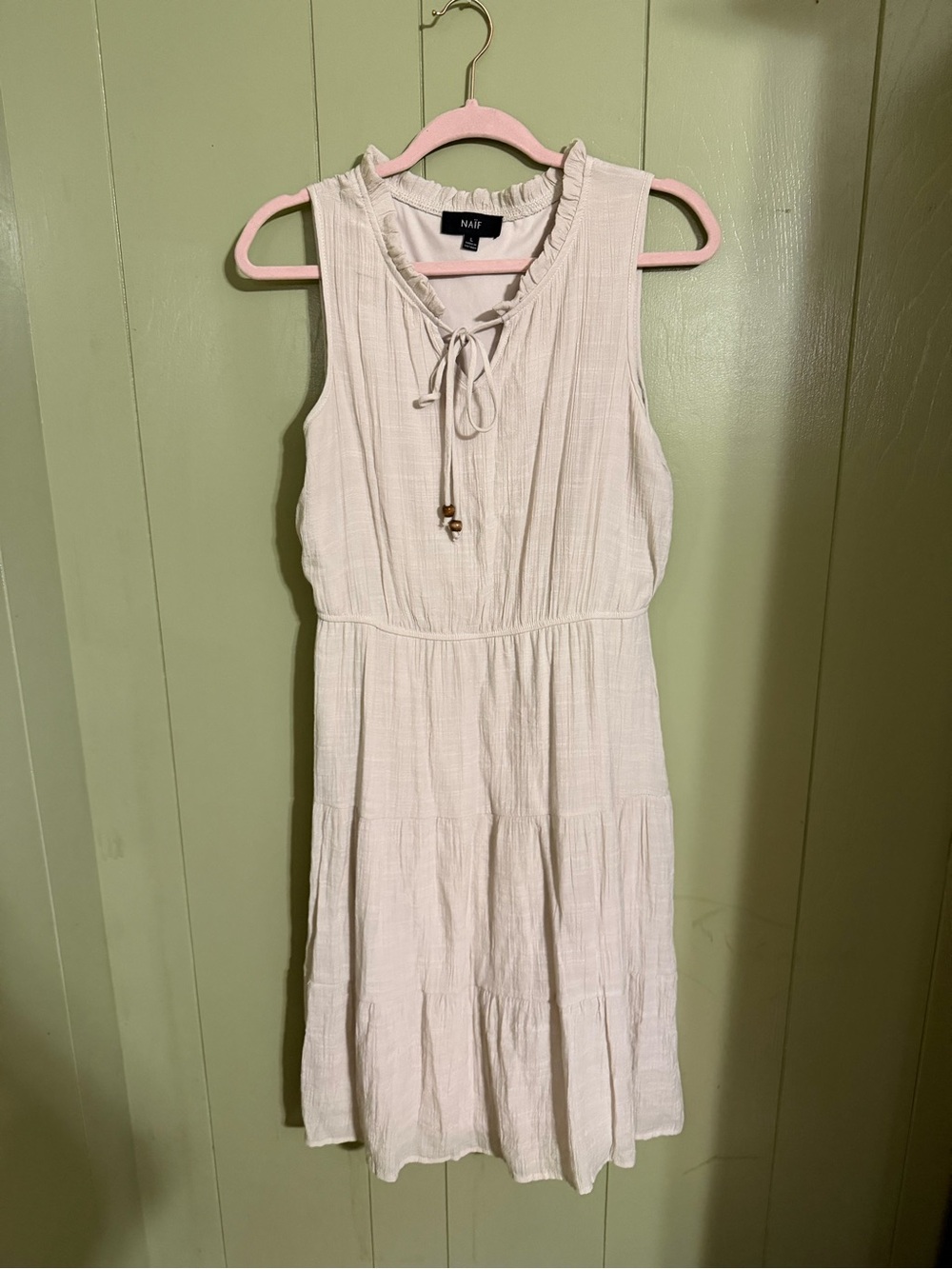 NAIF Cream Sleeveless Tiered Dress with Tie Neck